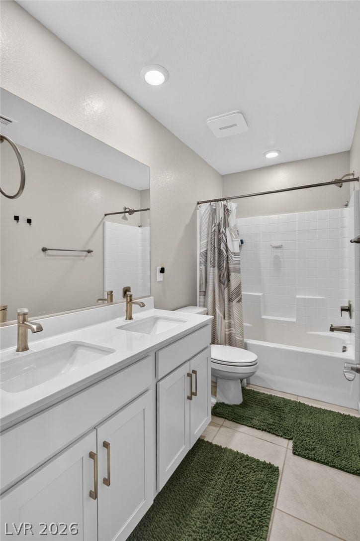 2719 High Echelon Road, North Las Vegas, NV 89086 Clean lines and a spacious double vanity define this modern bathroom space.