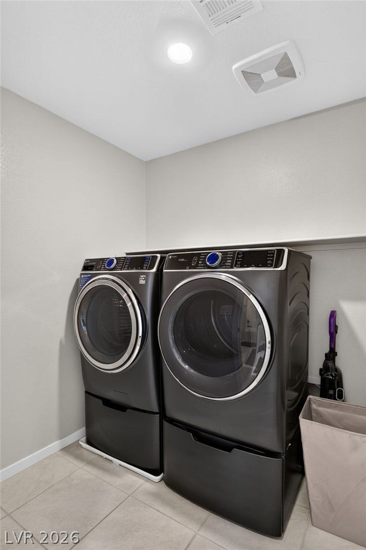 2719 High Echelon Road, North Las Vegas, NV 89086 Tiled flooring and recessed lighting accent this functional dedicated laundry space.