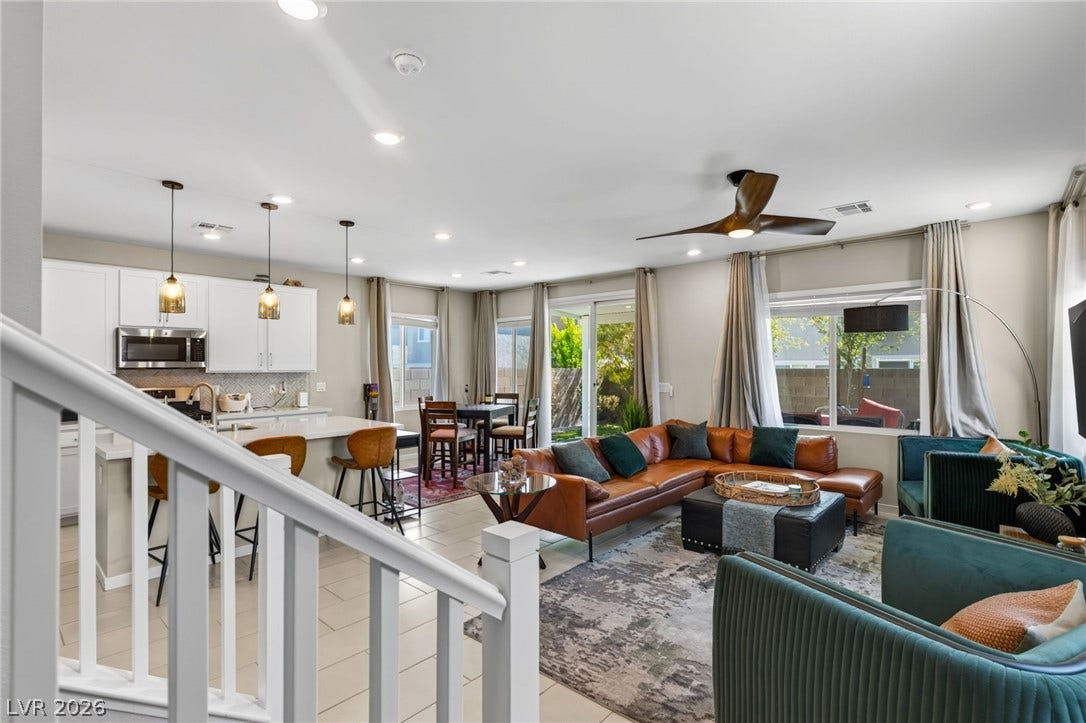 2719 High Echelon Road, North Las Vegas, NV 89086 An airy open-concept layout connects the kitchen, dining space, and living area seamlessly.
