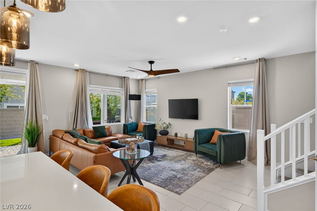 2719 High Echelon Road, North Las Vegas, NV 89086 An open living space highlights clean-lined tile flooring under recessed lighting.