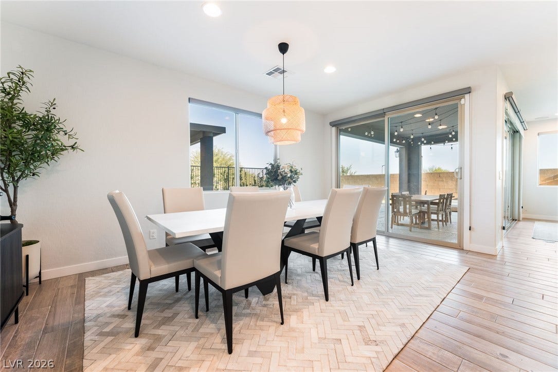 12424 Point Sierra Street, Las Vegas, NV 89138 Sliding glass doors connect this airy dining area directly to the covered patio.