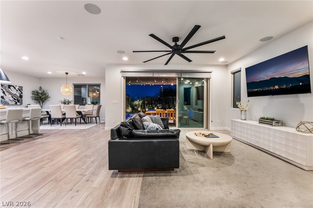 12424 Point Sierra Street, Las Vegas, NV 89138 An open floorplan design seamlessly connects the spacious living and dining areas to the outdoors.