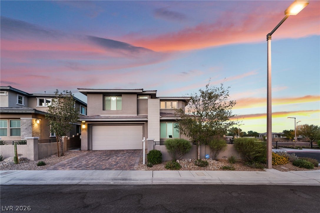 12424 Point Sierra Street, Las Vegas, NV 89138 Modern two-story architecture anchors this property, complete with a paved driveway and desert landscaping.