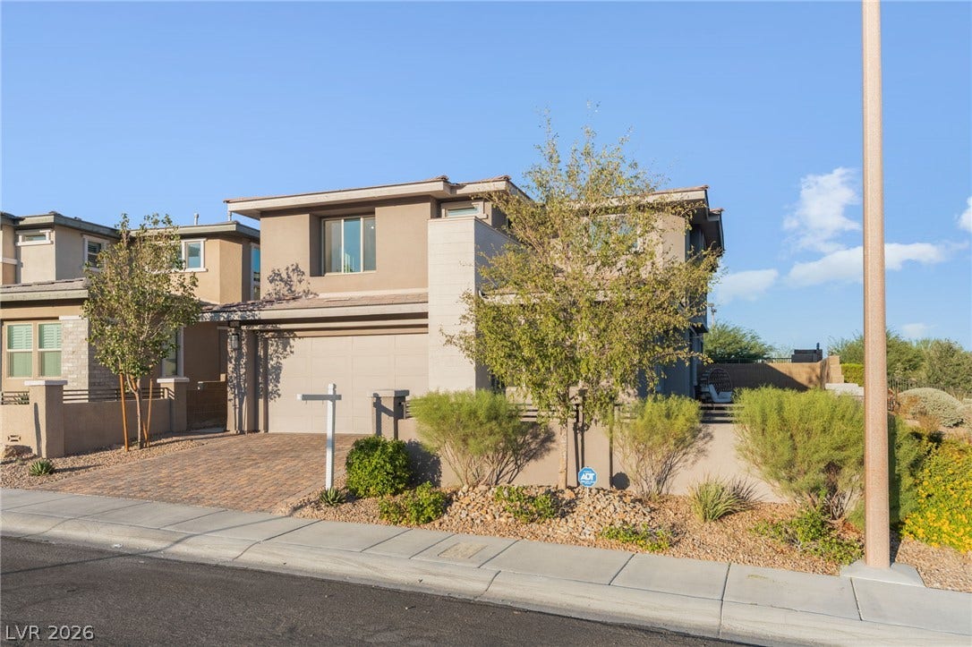12424 Point Sierra Street, Las Vegas, NV 89138 A modern exterior design highlights this multi-level home with an integrated two-car garage.