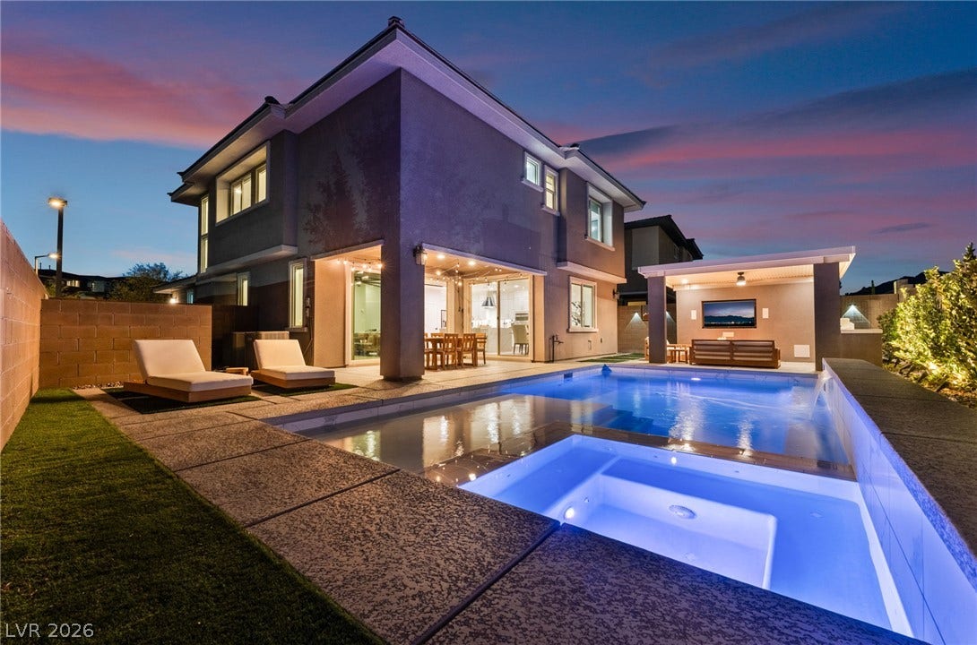 12424 Point Sierra Street, Las Vegas, NV 89138 An inviting swimming pool and integrated spa sit beside this contemporary two-story home.