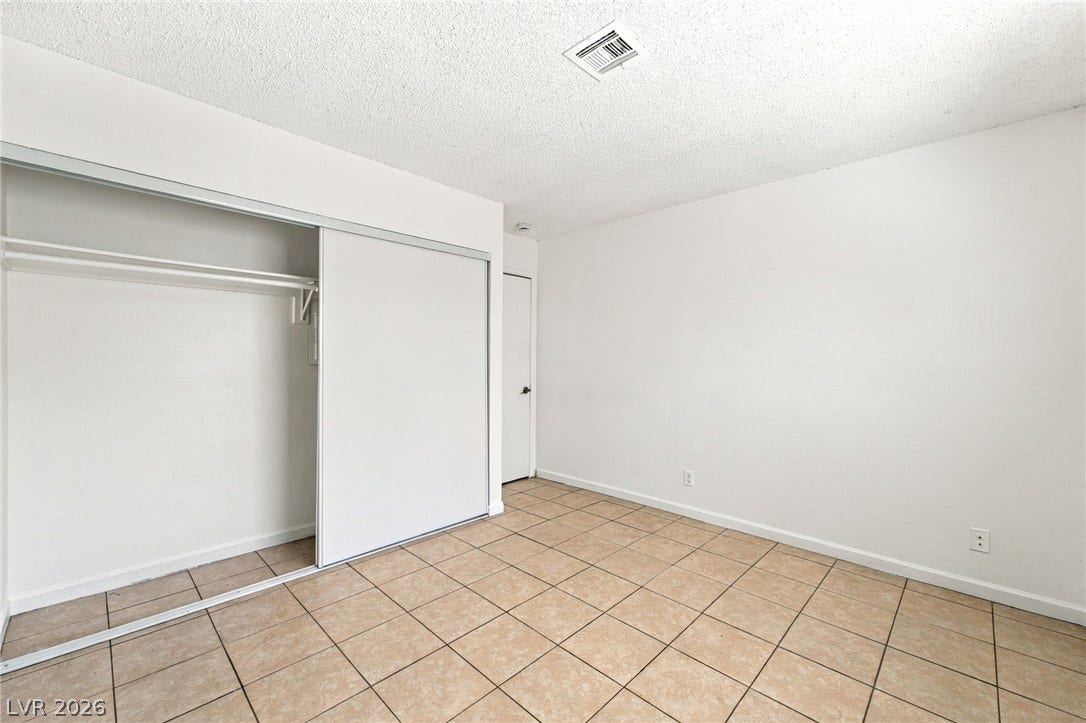 2553 Ellis Street, North Las Vegas, NV 89030 Tiled flooring and a sliding door closet define this functional space.