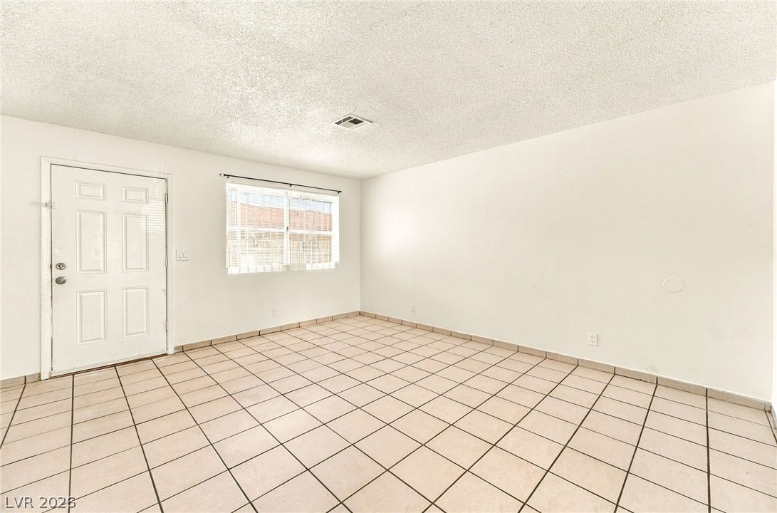 2553 Ellis Street, North Las Vegas, NV 89030 Durable tile flooring and a neutral color palette define this versatile living space.