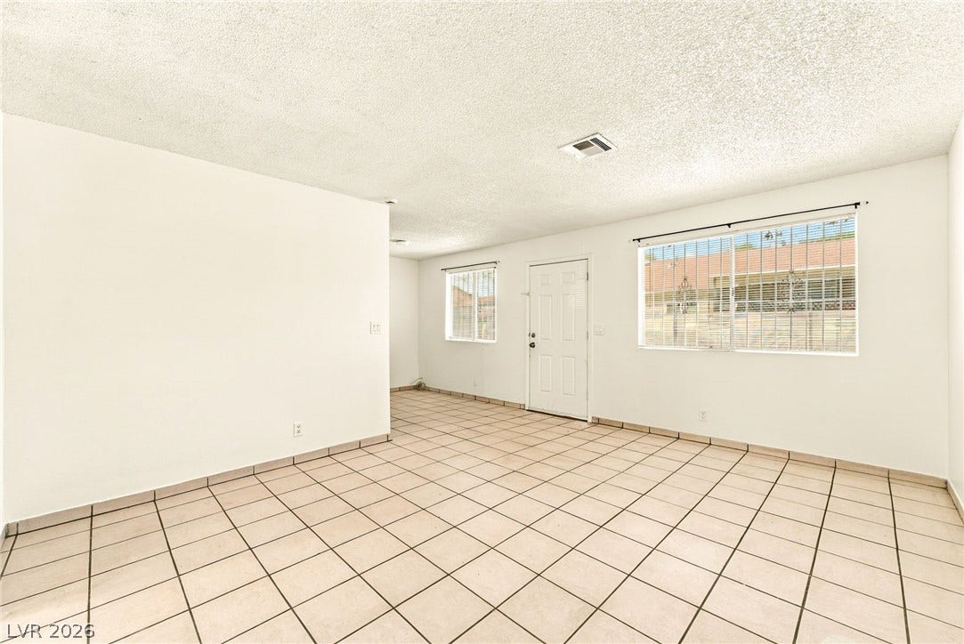 2553 Ellis Street, North Las Vegas, NV 89030 Clean tile flooring and a neutral color palette highlight this versatile living space.