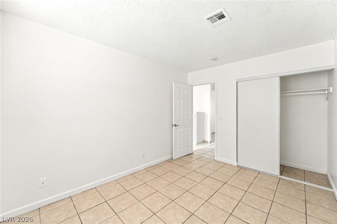 2553 Ellis Street, North Las Vegas, NV 89030 Durable tile flooring and a built-in closet define this versatile room.