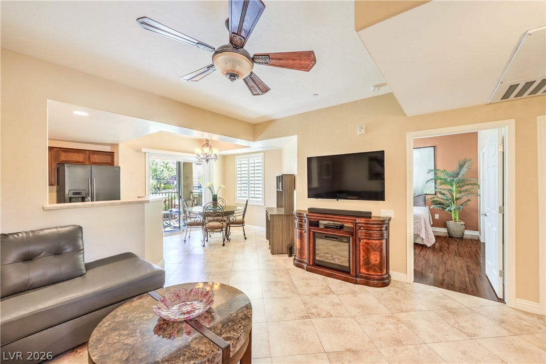 6868 Sky Pointe Drive, #1132, Las Vegas, NV 89131 Tiled flooring flows through an open-concept layout connecting the main living spaces.