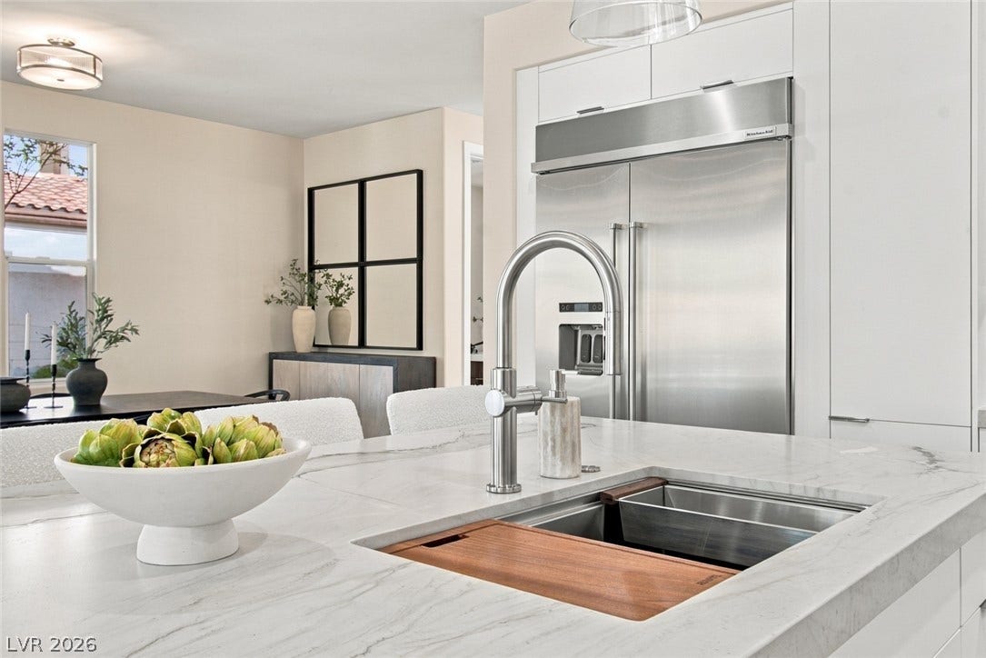 2837 Turtle Head Peak Drive, Las Vegas, NV 89135 Premium stone countertops and high-end stainless steel appliances anchor this modern culinary workspace.
