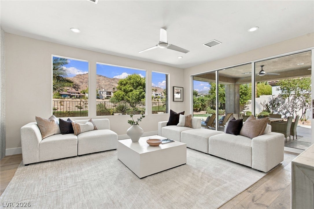2837 Turtle Head Peak Drive, Las Vegas, NV 89135 Generous windows frame serene desert mountain vistas from this spacious living area.