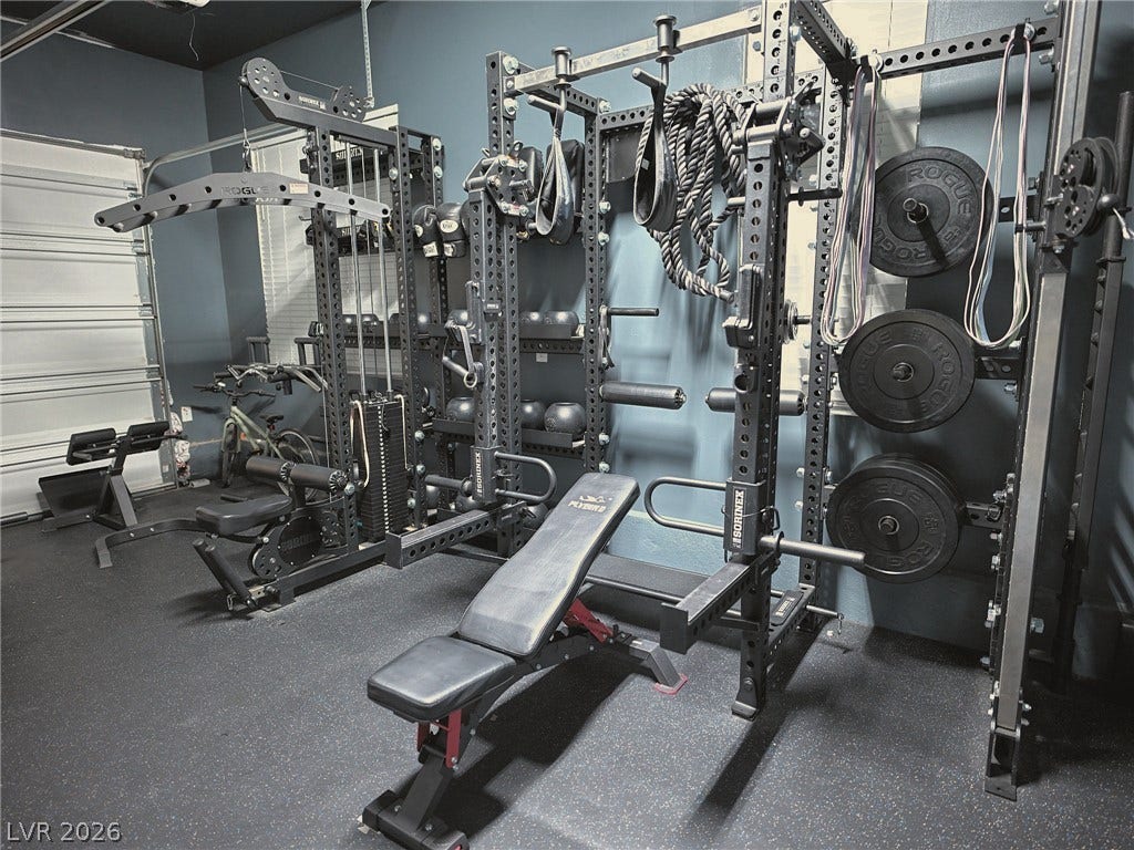 270 Shaded Canyon Drive, Henderson, NV 89012 A fully equipped home gym setup features specialized flooring and professional-grade training racks.