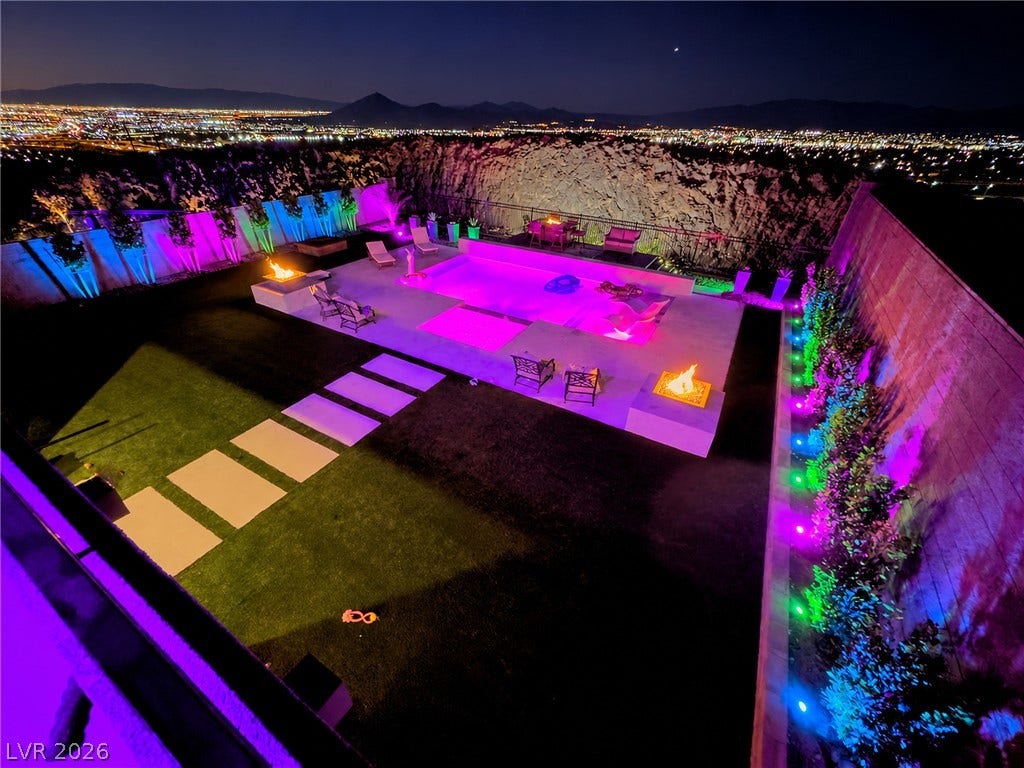 270 Shaded Canyon Drive, Henderson, NV 89012 Panoramic city light views provide a dramatic backdrop for the sprawling backyard oasis.