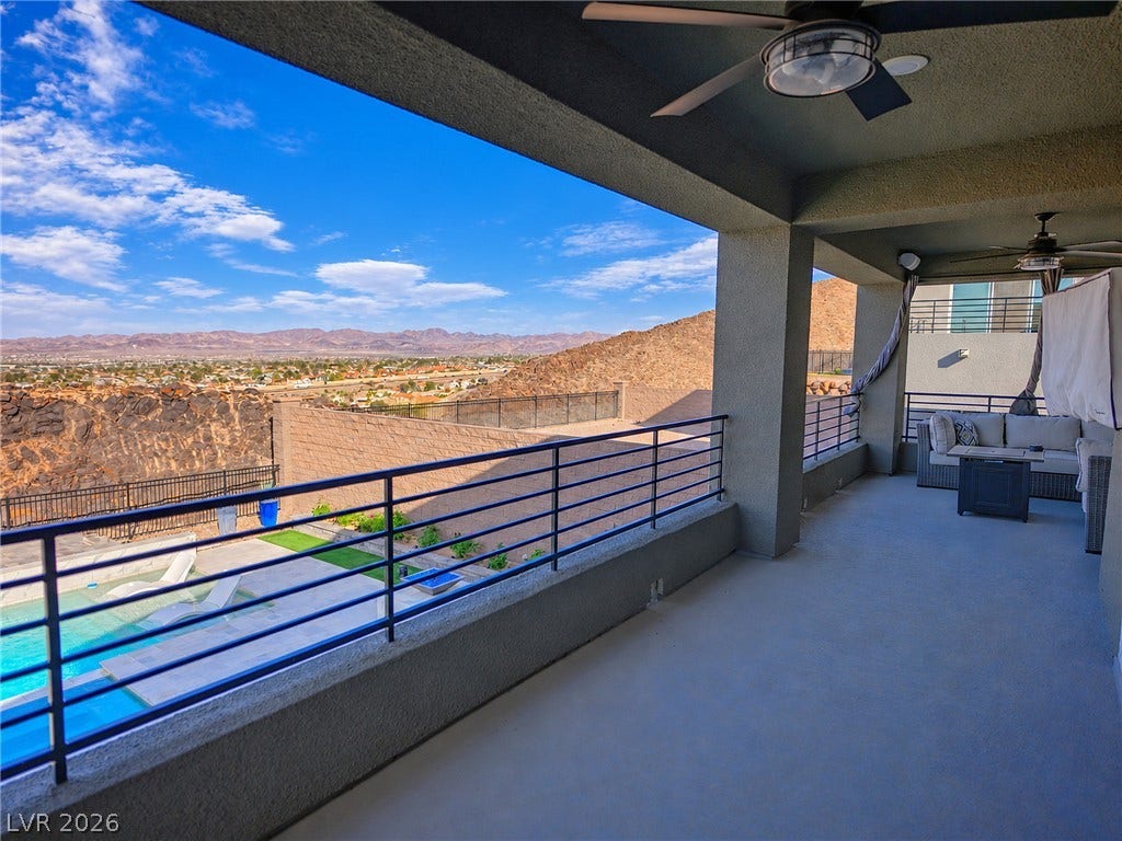 270 Shaded Canyon Drive, Henderson, NV 89012 A spacious covered balcony frames sweeping desert, mountain, and valley views.