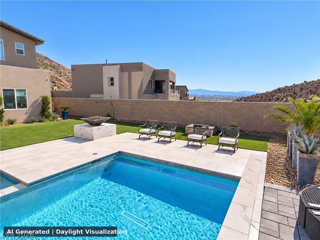 270 Shaded Canyon Drive, Henderson, NV 89012 An inviting backyard oasis showcases a sparkling pool framed by modern stone pavers.