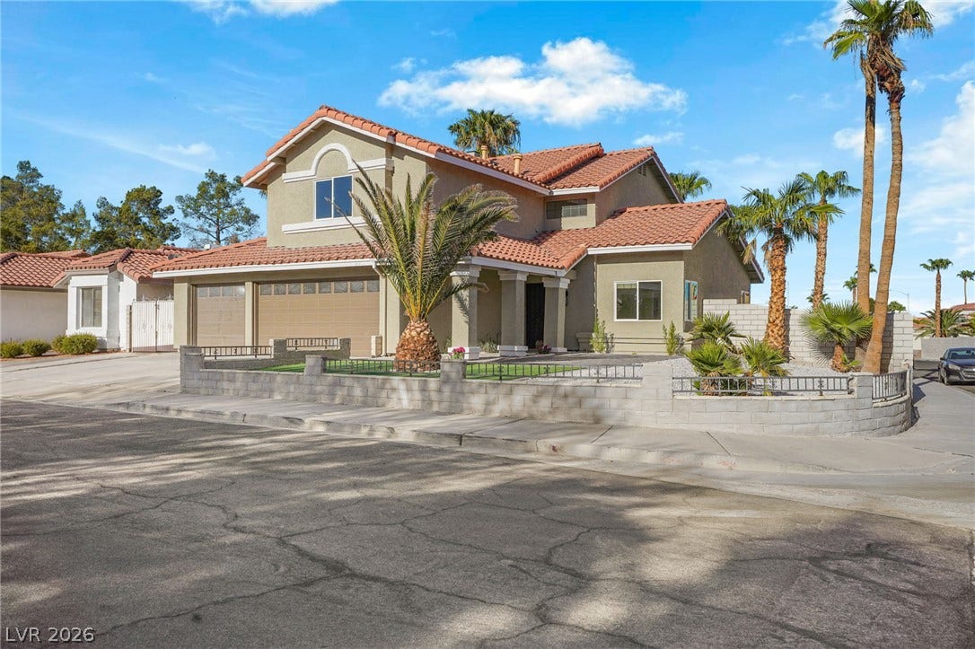 Spanish tile roofing and structured stucco walls define this classic desert exterior architecture.