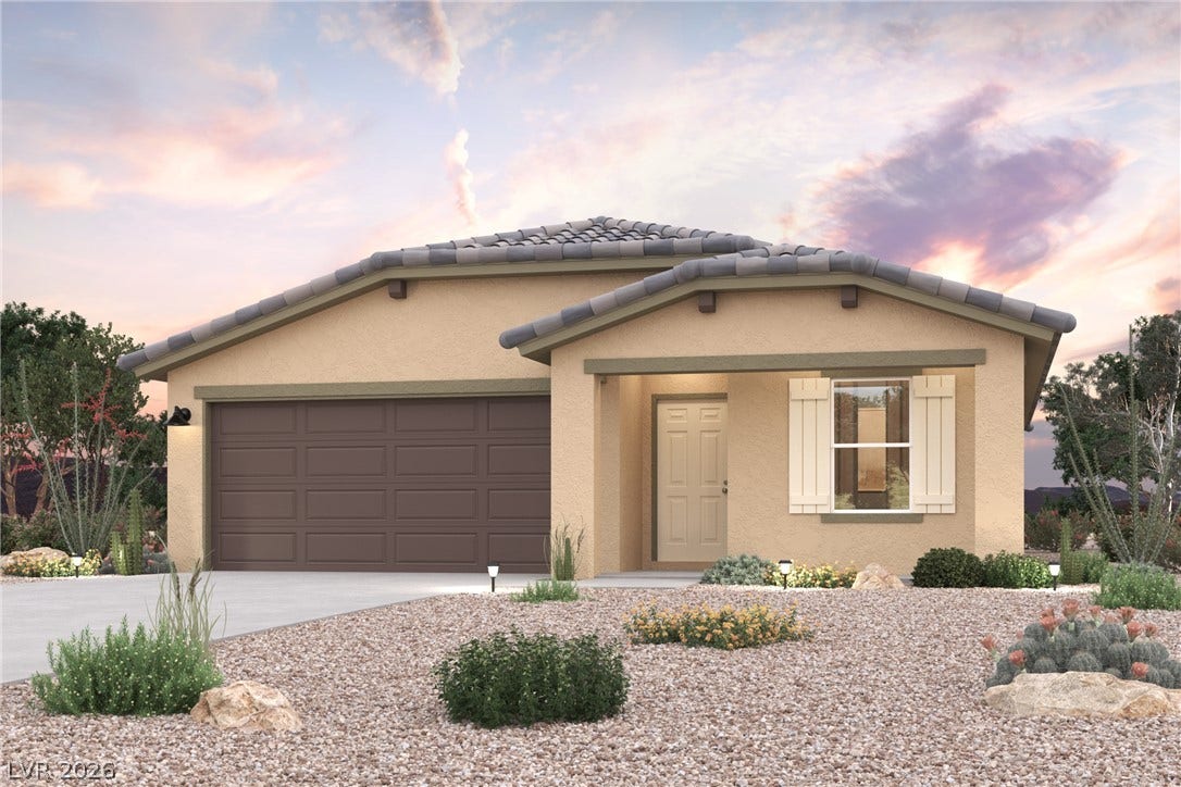 A well-maintained desert landscape frames this welcoming single-story home with an integrated garage.