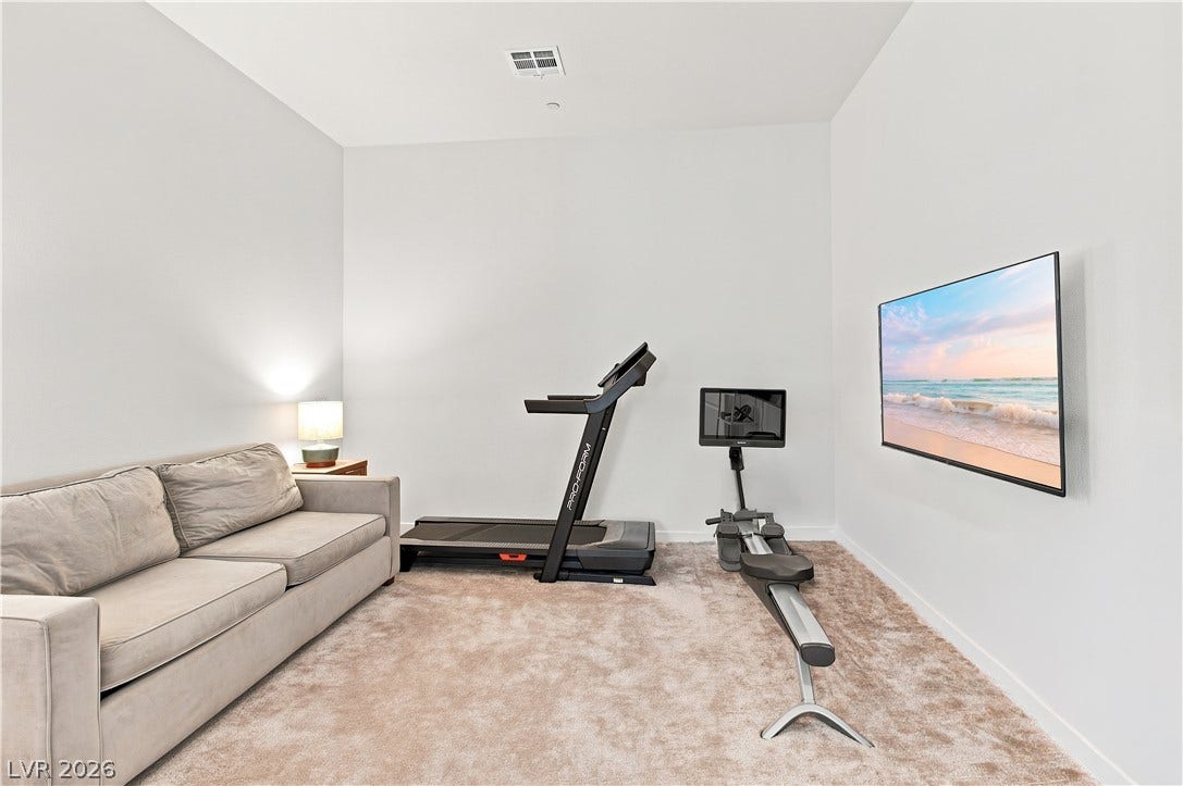 5745 N Golden Chase Court, Las Vegas, NV 89131 High ceilings and wall-to-wall carpeting define this versatile flex space.