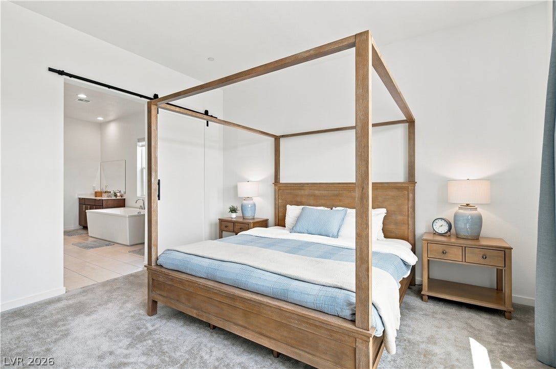 5745 N Golden Chase Court, Las Vegas, NV 89131 High ceilings and clean walls create an airy ambiance in this primary bedroom retreat.