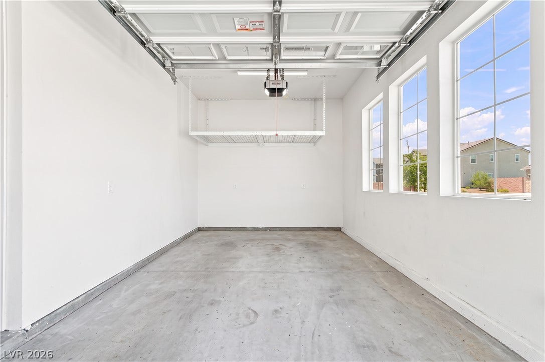 5745 N Golden Chase Court, Las Vegas, NV 89131 Generous windows fill this clean garage space with abundant natural light.