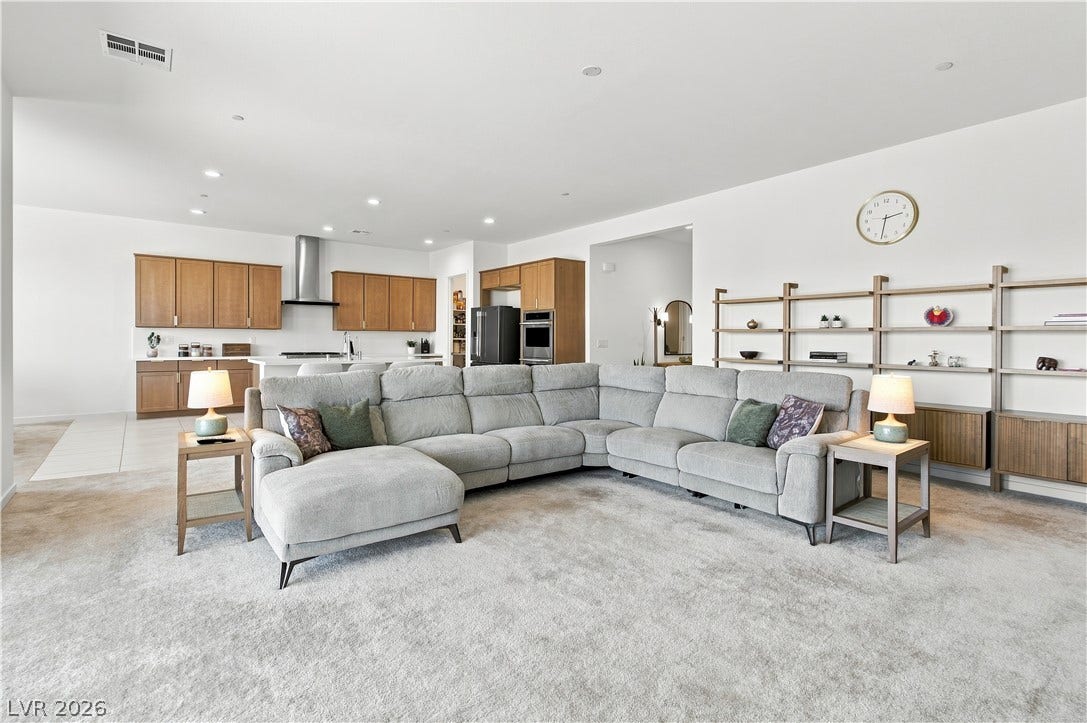 5745 N Golden Chase Court, Las Vegas, NV 89131 An open layout connects the comfortable living space directly to the kitchen.