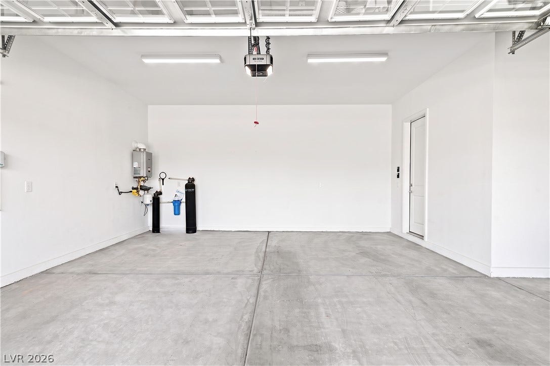 5745 N Golden Chase Court, Las Vegas, NV 89131 A spacious and pristine storage area features durable concrete flooring under bright overhead lighting.