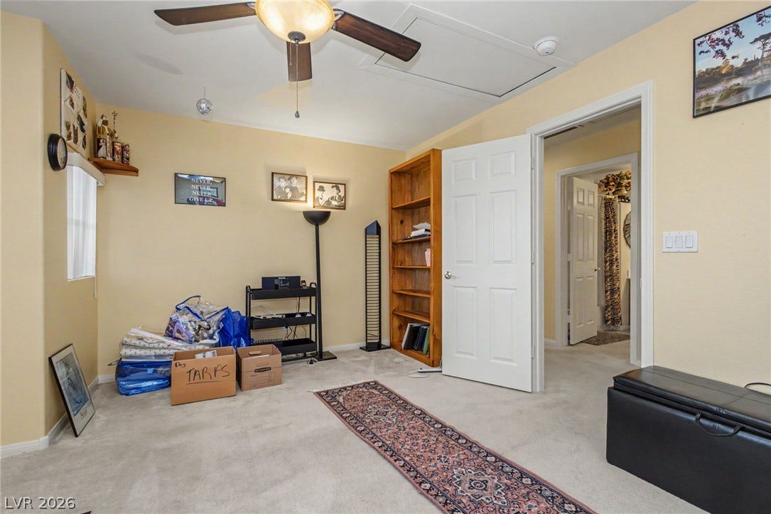 Plush wall-to-wall carpeting and soft neutral walls define this versatile secondary space.