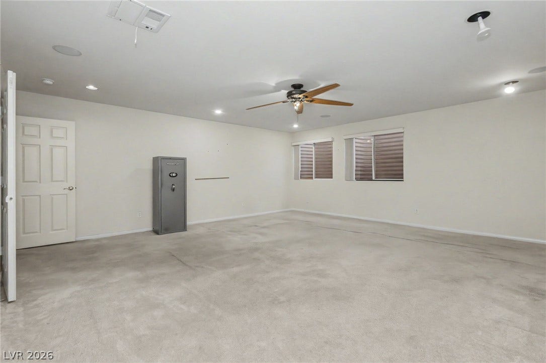 A spacious carpeted lower level offers flexible living options with recessed lighting.