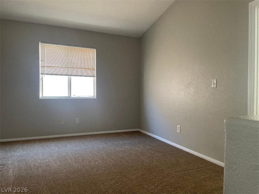 3025 Sunrise Bay Avenue, North Las Vegas, NV 89031 Vaulted ceilings and soft carpeting define this inviting LOFT space.