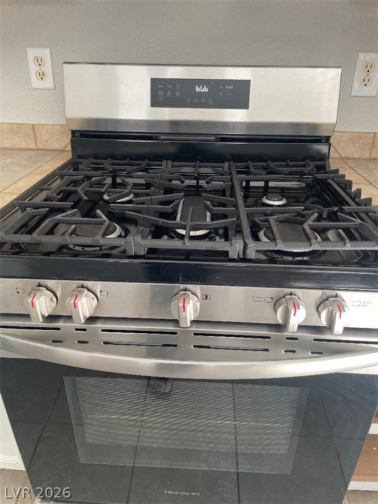 3025 Sunrise Bay Avenue, North Las Vegas, NV 89031 Modern gas range offers home chefs robust cooking performance in a thoughtfully designed space.