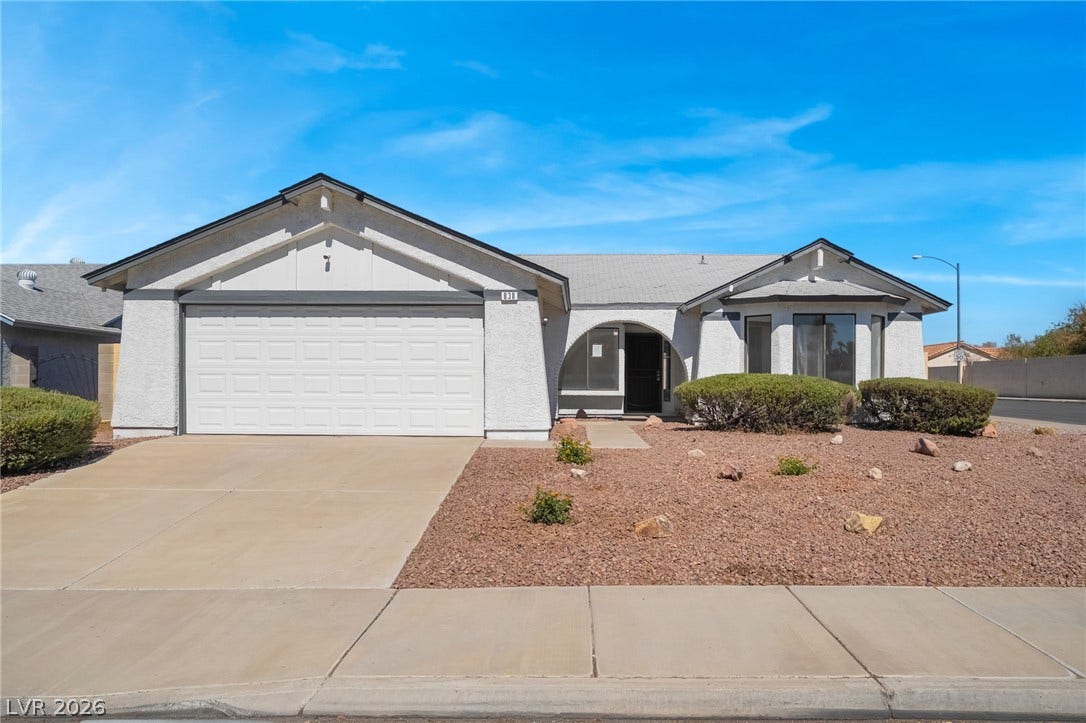 838 Anchor Drive, Henderson, NV 89015 An inviting stucco facade features a double garage and low-maintenance desert landscaping.