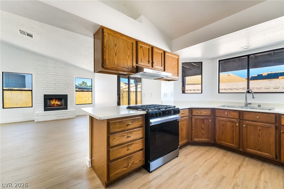 838 Anchor Drive, Henderson, NV 89015 Warm wood cabinetry and durable hard surface flooring enrich this functional cooking area.
