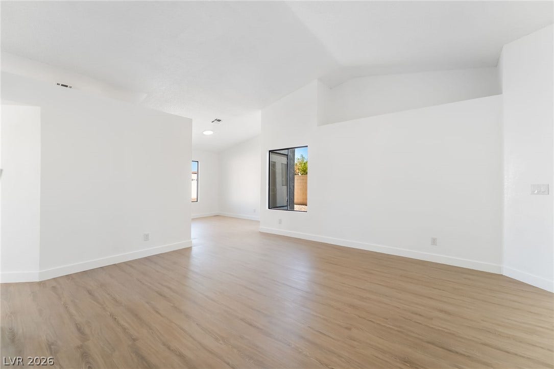 838 Anchor Drive, Henderson, NV 89015 Clean lines and smooth flooring define this airy, open-concept living space with vaulted ceilings.