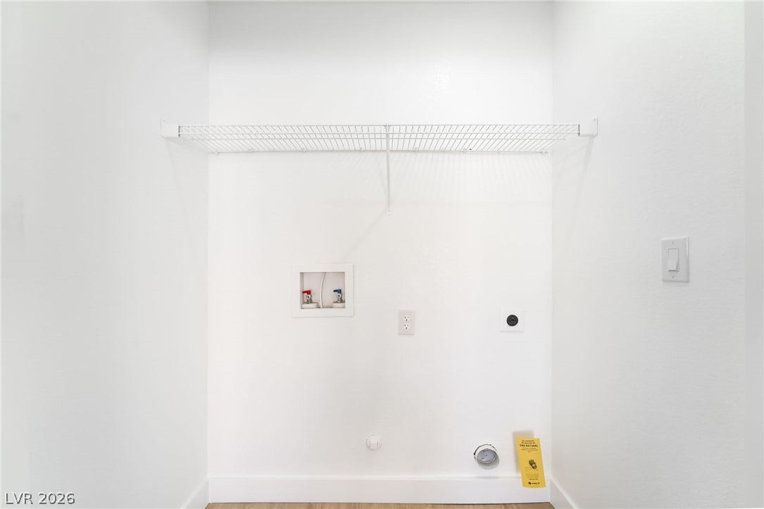 838 Anchor Drive, Henderson, NV 89015 A dedicated laundry closet includes essential hookups and practical overhead shelving.