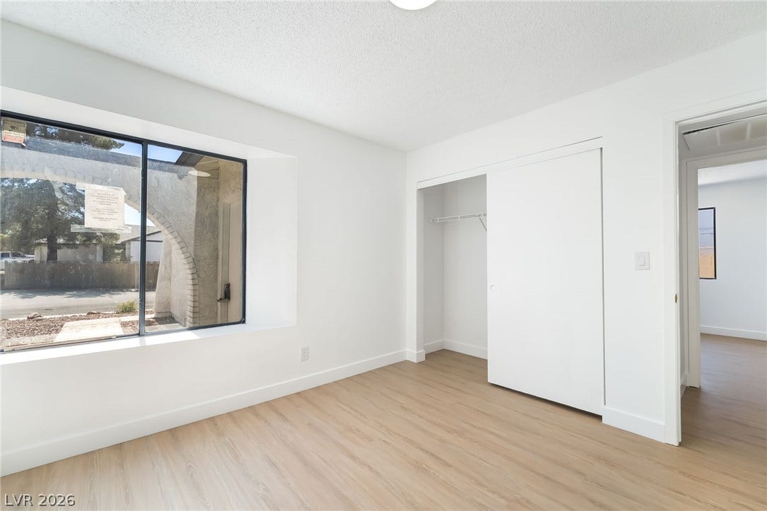 838 Anchor Drive, Henderson, NV 89015 Crisp walls and wood-look flooring define this versatile room with a deep window sill.