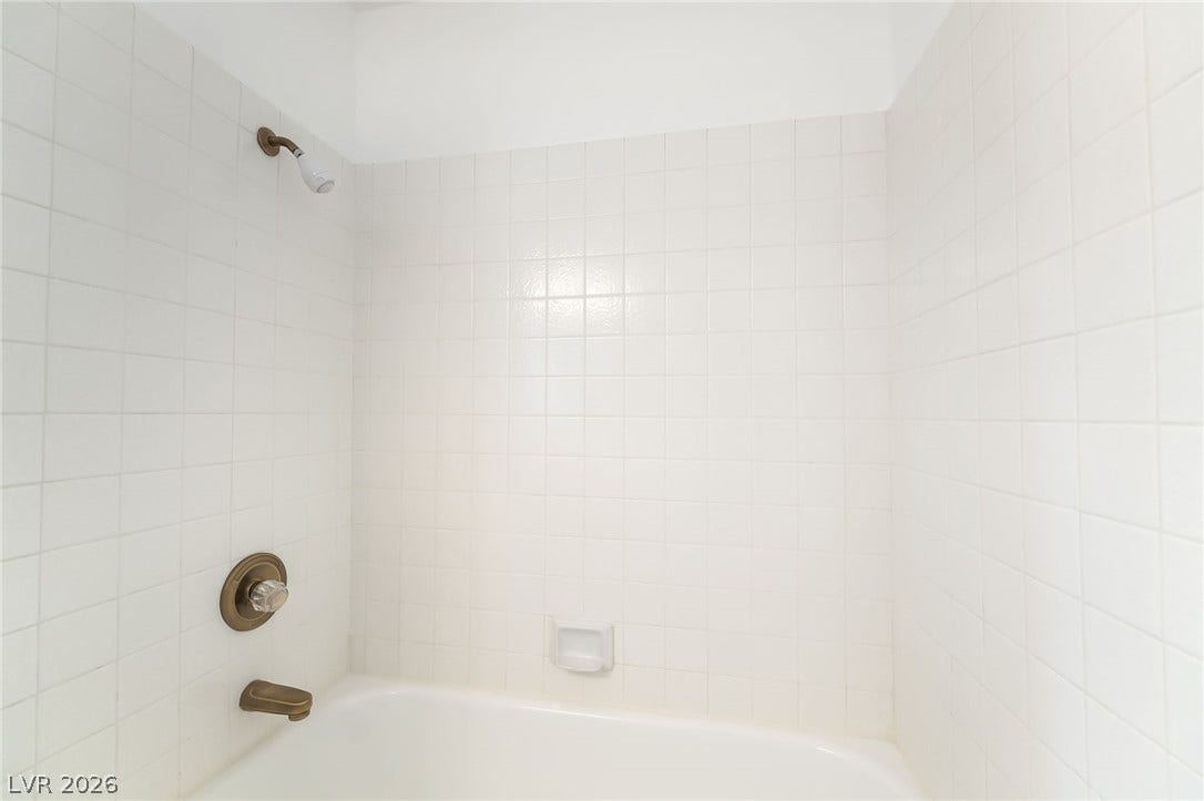 838 Anchor Drive, Henderson, NV 89015 Clean square tile surrounds a classic shower and tub combination.