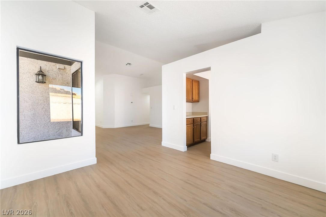838 Anchor Drive, Henderson, NV 89015 Crisp white walls and clean wood-look flooring establish a bright, modern interior aesthetic.