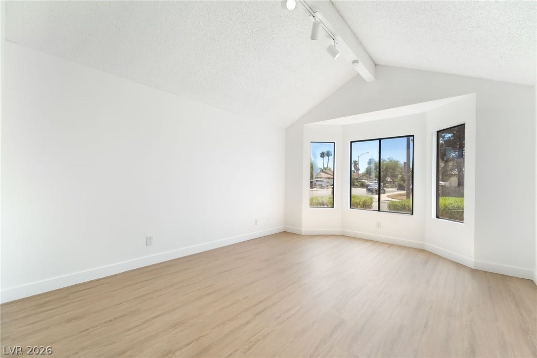 838 Anchor Drive, Henderson, NV 89015 Angled bay windows and vaulted ceilings create an open, airy feel over wood-look flooring.
