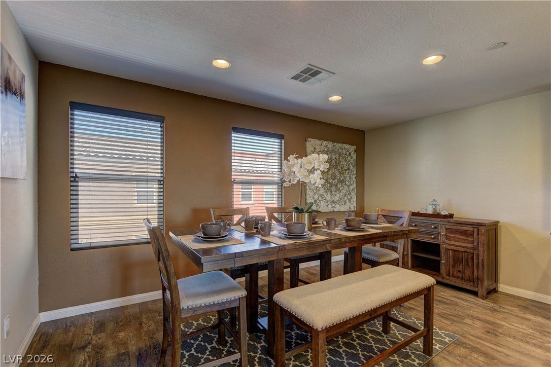 4650 Ranch House Road, #14, North Las Vegas, NV 89031 Rich wood flooring pairs with recessed lighting in this inviting dining room.