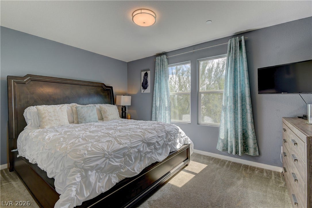 4650 Ranch House Road, #14, North Las Vegas, NV 89031 Plentiful natural light streams through dual windows onto plush carpeted flooring.
