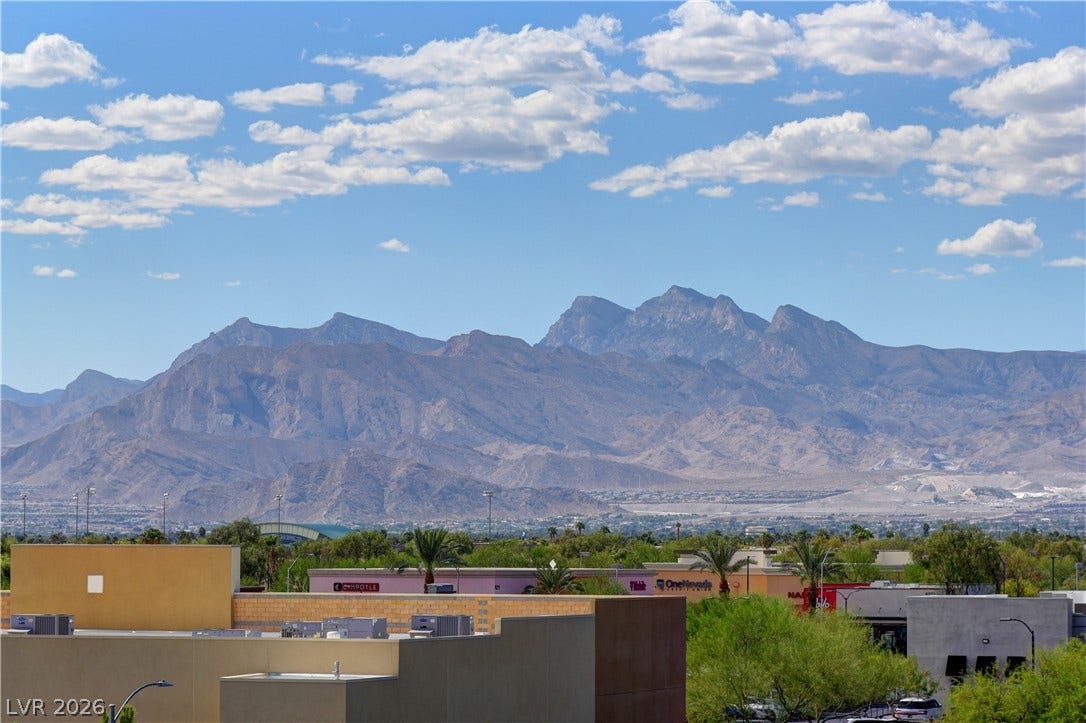 4650 Ranch House Road, #14, North Las Vegas, NV 89031 Rugged peaks frame the horizon beyond the surrounding neighborhood.