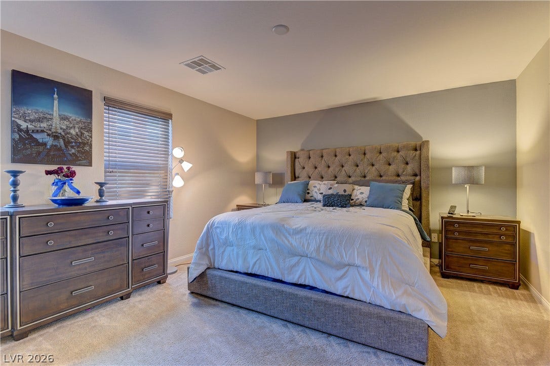 4650 Ranch House Road, #14, North Las Vegas, NV 89031 Soft carpeting pairs with a neutral color palette in this comfortable sleeping sanctuary.