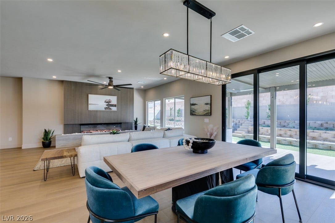 2897 Sunlit Glade Avenue, Henderson, NV 89074 Sliding glass doors open from the dining space to an inviting covered patio.
