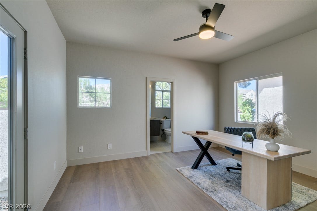 2897 Sunlit Glade Avenue, Henderson, NV 89074 Smooth wood floors and neutral plaster walls define this quiet, light-filled workspace.