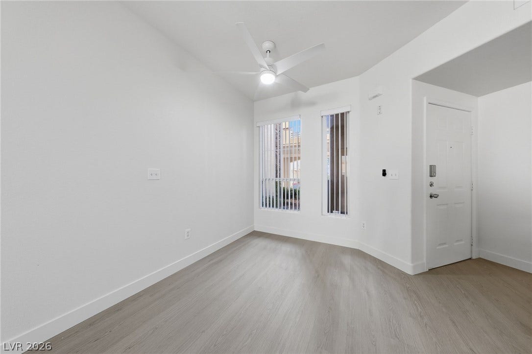 7139 S Durango Drive, #110, Las Vegas, NV 89113 Crisp white walls and clean modern flooring define this versatile entry space.