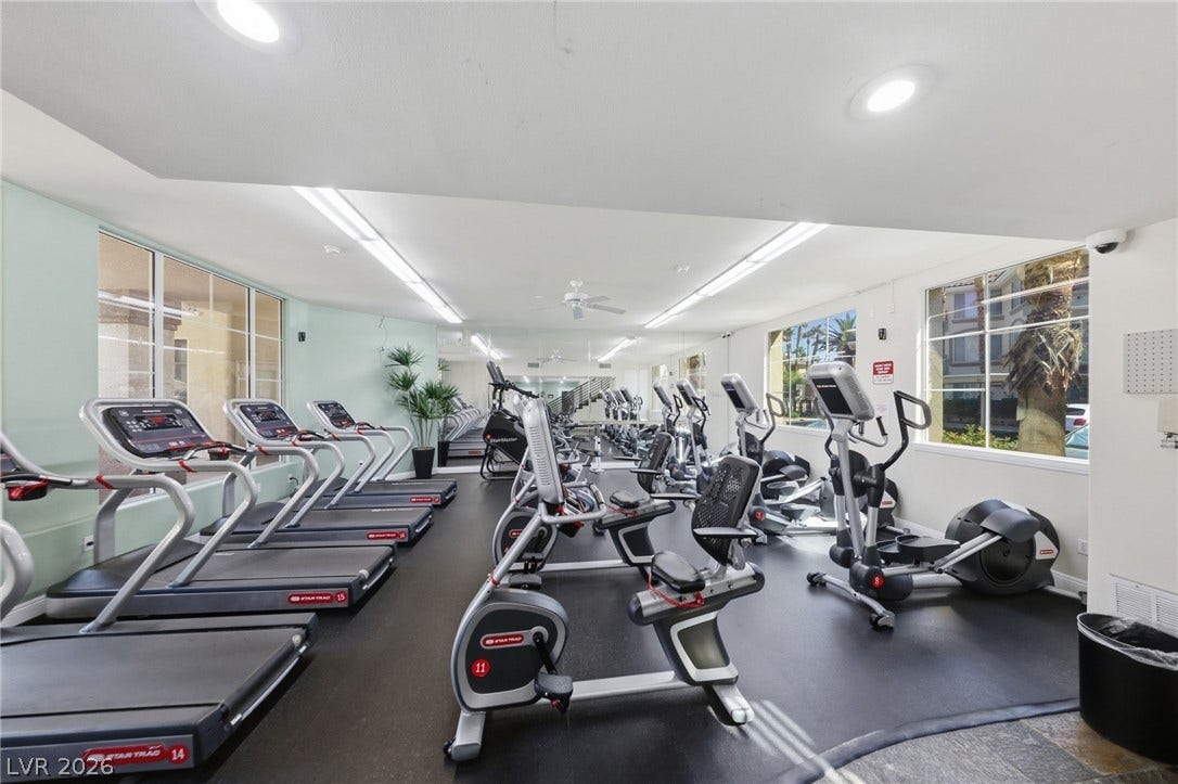 7139 S Durango Drive, #110, Las Vegas, NV 89113 A well-equipped fitness center offers smooth flooring and oversized windows letting in daylight.
