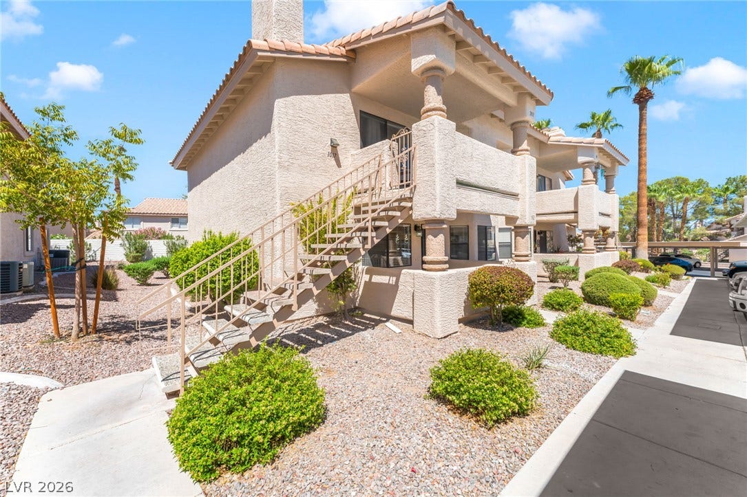 1017 Falconhead Lane, #102, Las Vegas, NV 89128 Stucco exteriors and tiled roofs define these multi-level residences bordered by desert landscaping.