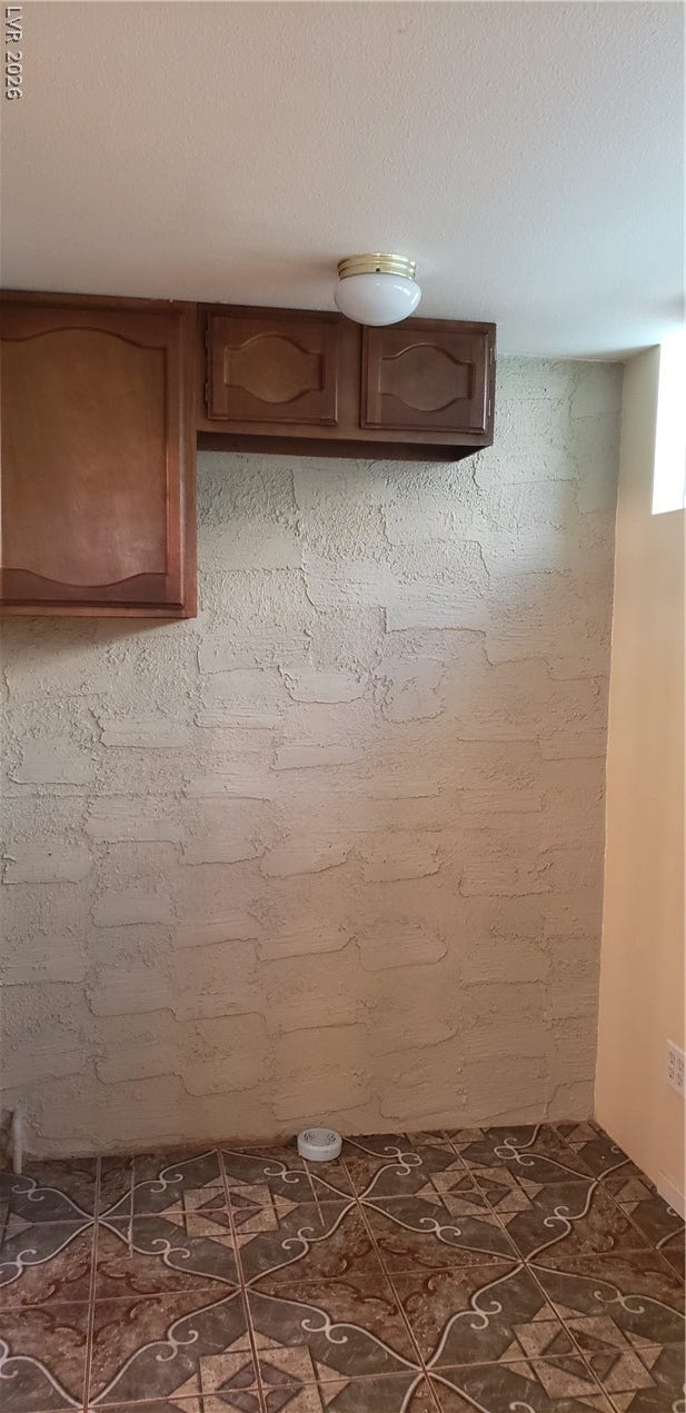 Textured plaster walls and patterned floor tile bring classic character to this versatile basement space.