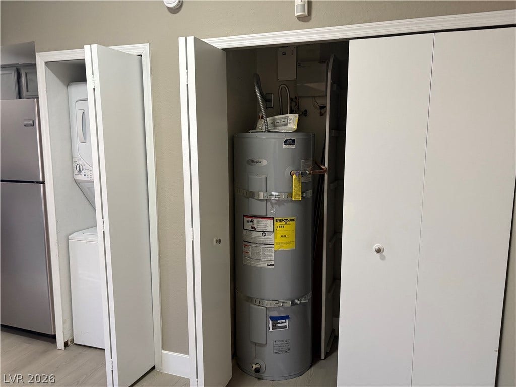 Functional storage closets house essential home systems alongside convenient in-unit laundry hookups.